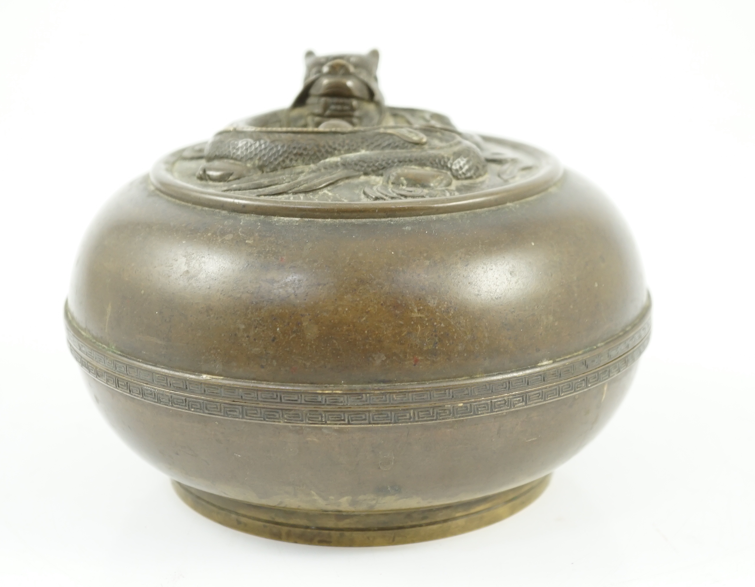 A Chinese bronze 'dragon' circular incense box and cover, Xuande seal mark, 18th/19th century